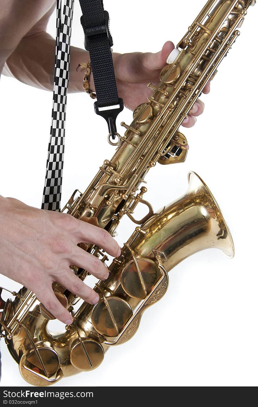 Shirtless jazzman plays a saxophone