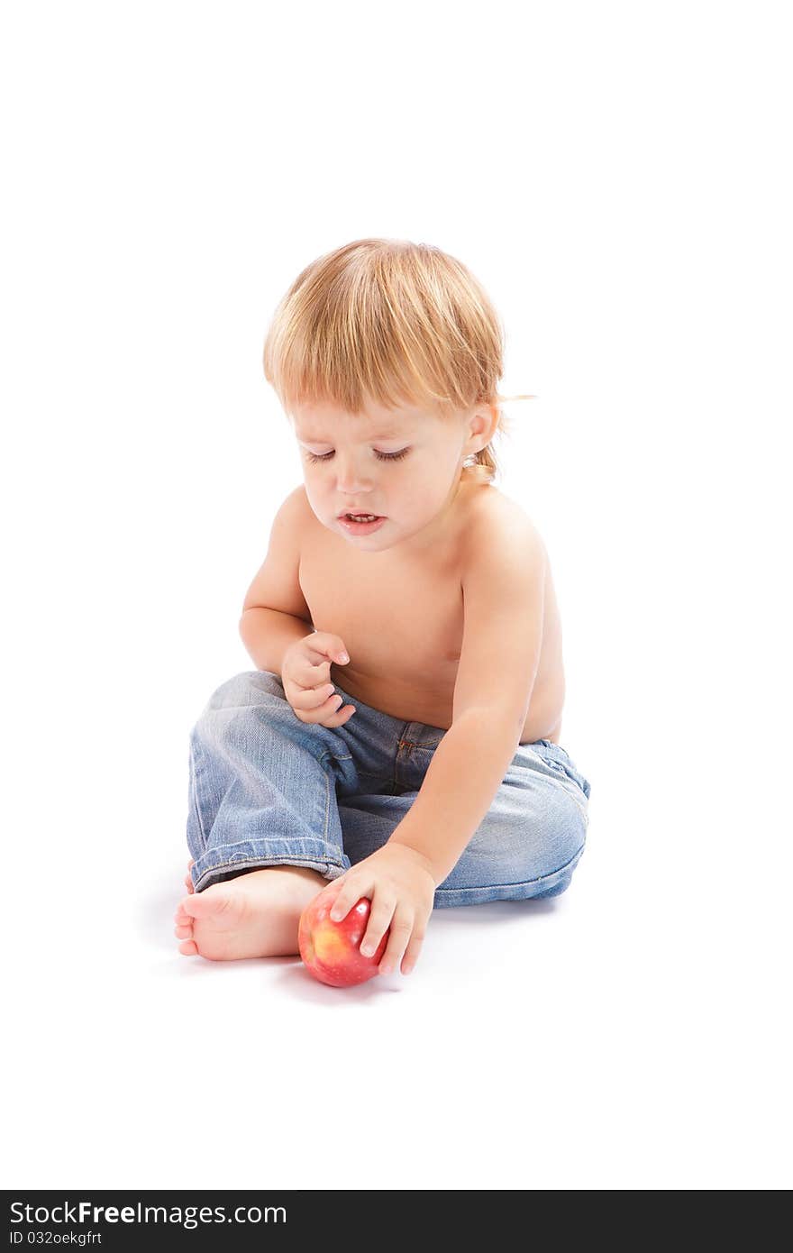 Little boy with an apple on a white background