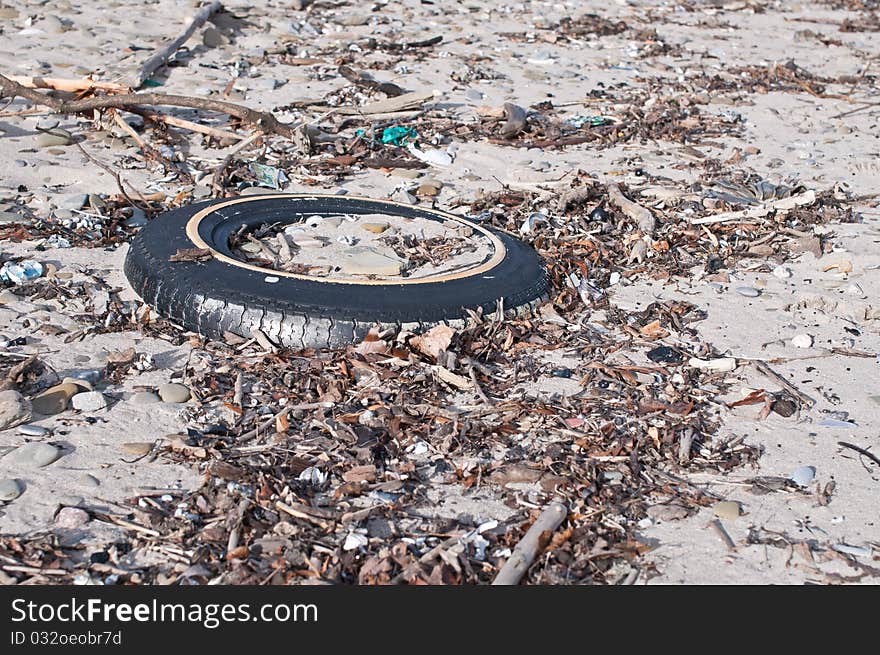 Tire and Other Litter on a Beach