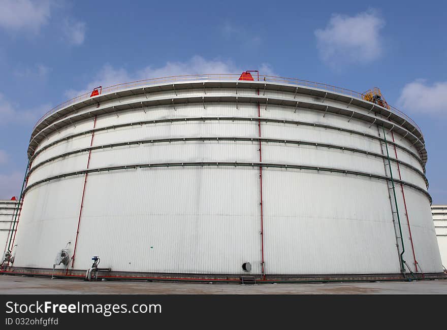 The storage tanks at an oil refinery complex. The storage tanks at an oil refinery complex