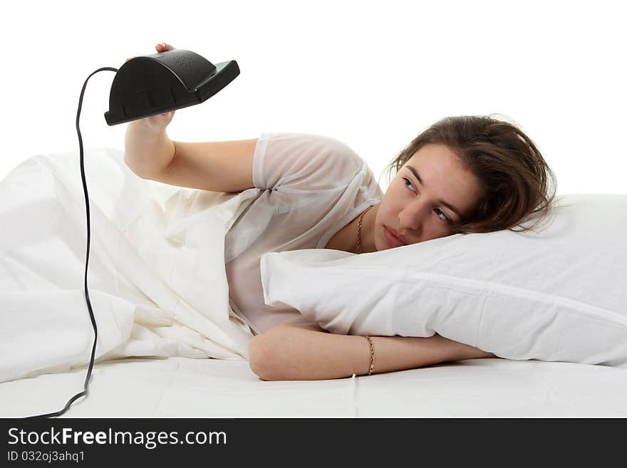 Woman In A Bed With Alarm Clock