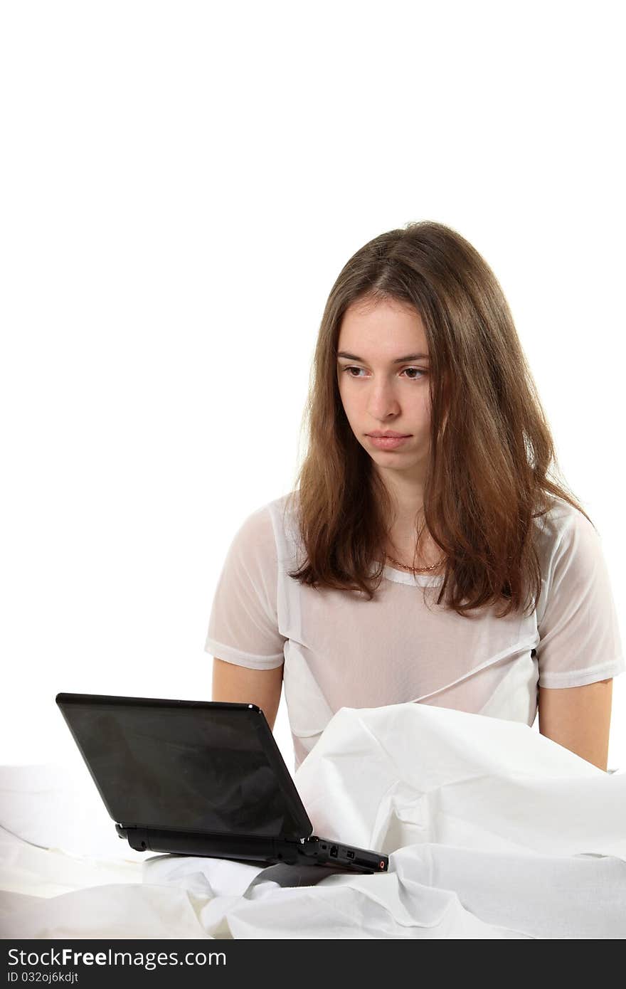 Woman in a bed with notebook