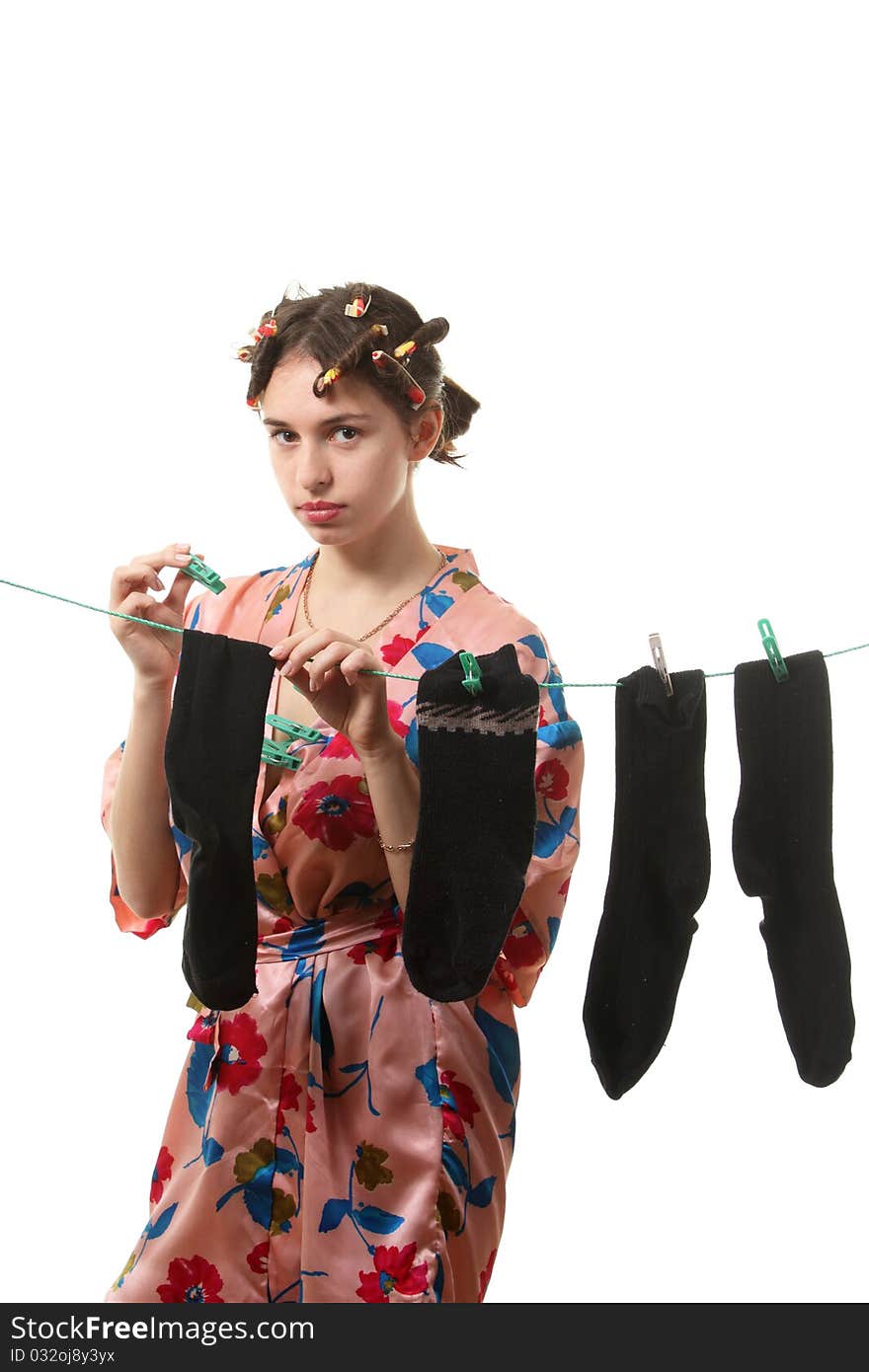 Housewife hangs up socks on  the clothesline