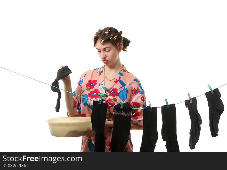 Housewife hangs up socks on  the clothesline