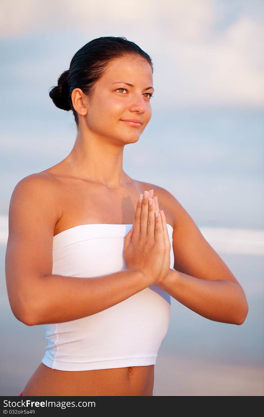 Beautiful woman relaxing by the seaside. Beautiful woman relaxing by the seaside