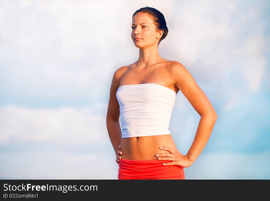 Beautiful woman relaxing by the seaside. Beautiful woman relaxing by the seaside