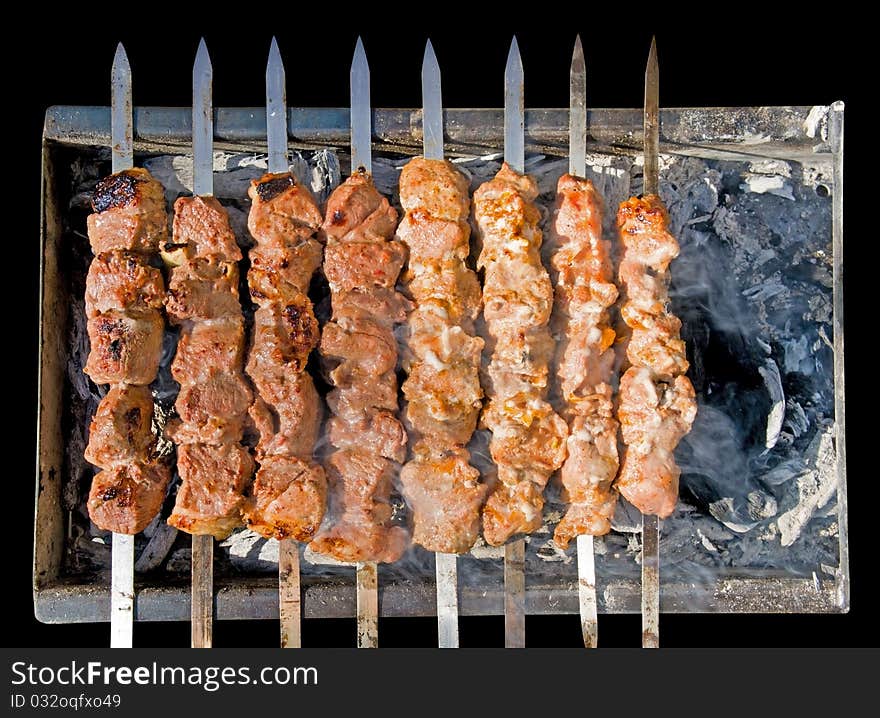 Shashlik (shish kebab) - traditional georgian barbecue prepared on a vine wood coal. Clipping path.