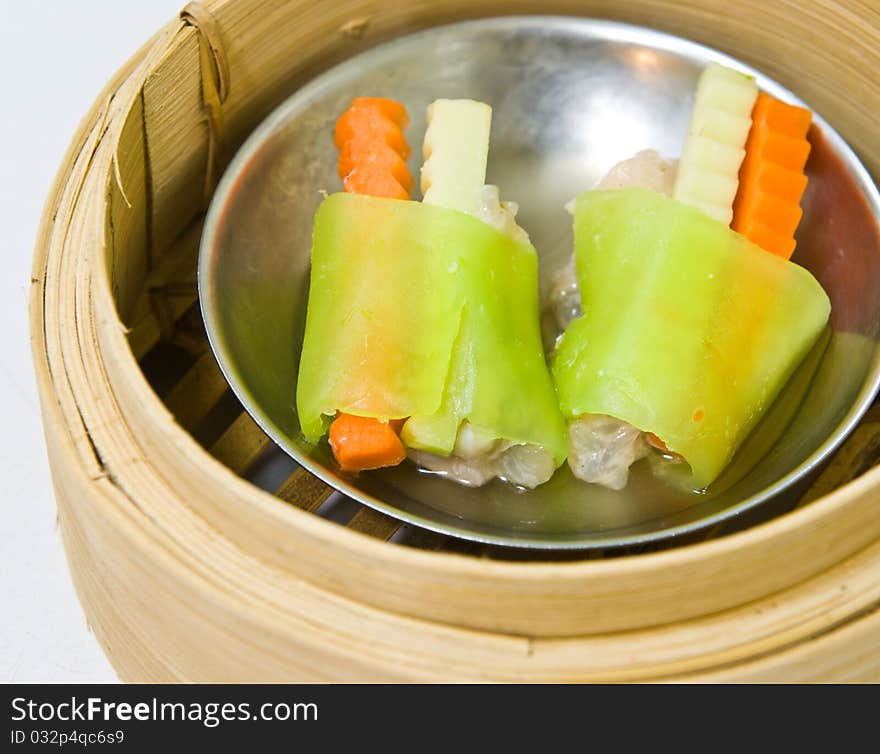 Chinese steamed dimsum in bamboo containers traditional cuisine. Chinese steamed dimsum in bamboo containers traditional cuisine