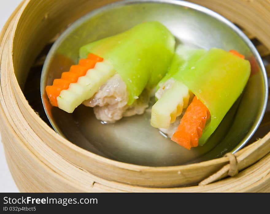 Chinese steamed dimsum in bamboo containers traditional cuisine. Chinese steamed dimsum in bamboo containers traditional cuisine