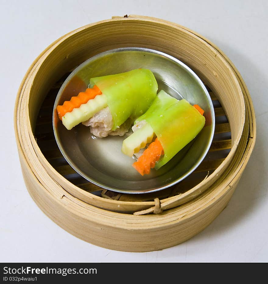 Chinese steamed shrimp dimsum in bamboo containers traditional cuisine. Chinese steamed shrimp dimsum in bamboo containers traditional cuisine