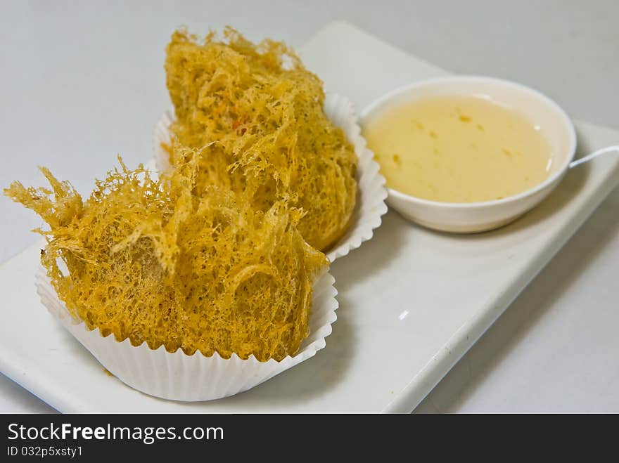 Fried taro stuffed chicken on a plate. Fried taro stuffed chicken on a plate