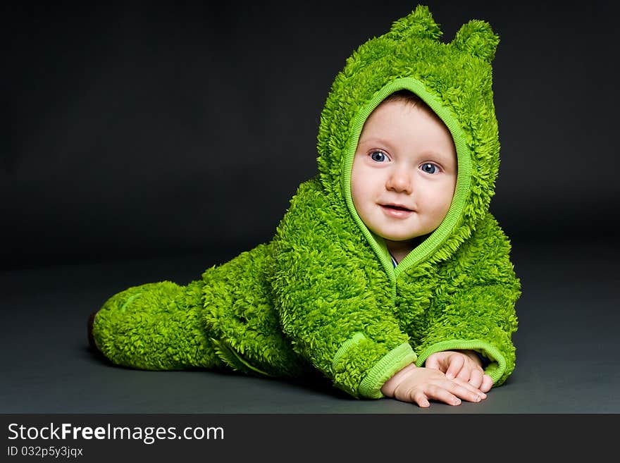 Baby in a frog outfit