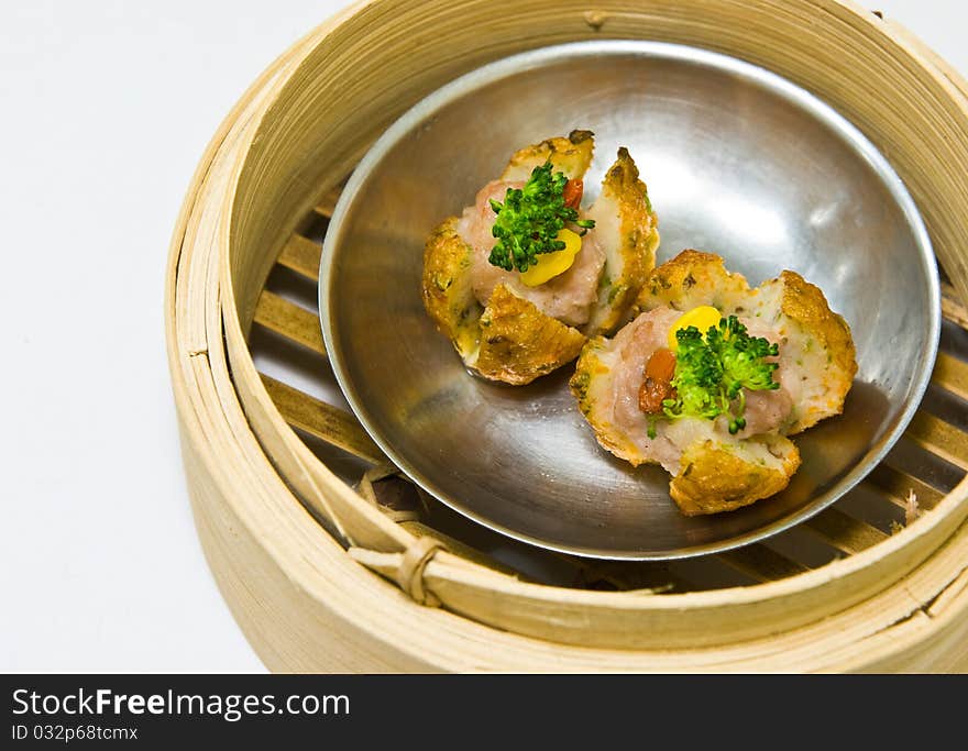 Chinese steamed dimsum in bamboo containers traditional cuisine. Chinese steamed dimsum in bamboo containers traditional cuisine