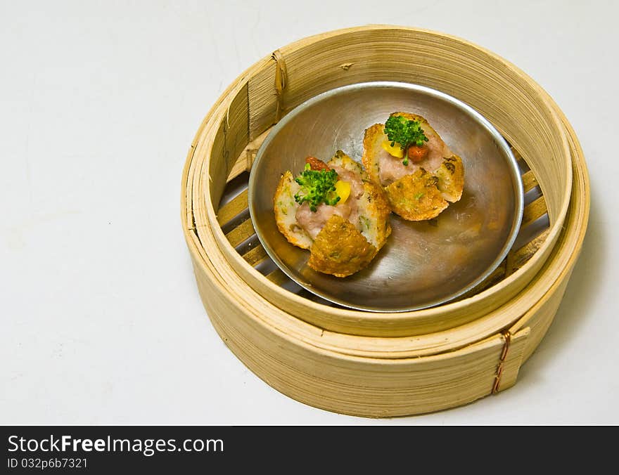 Chinese steamed dimsum in bamboo containers traditional cuisine. Chinese steamed dimsum in bamboo containers traditional cuisine