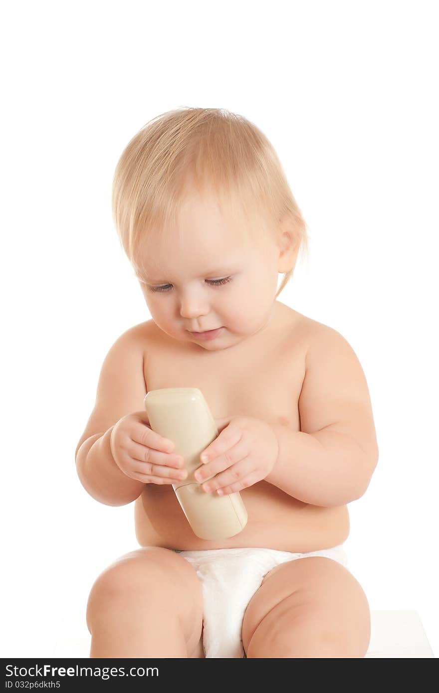 Portrait of happy young sitting baby with phone in hand. Portrait of happy young sitting baby with phone in hand