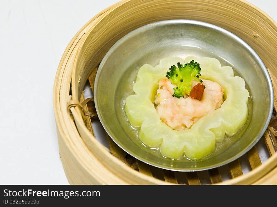 Chinese steamed dimsum in bamboo containers traditional cuisine. Chinese steamed dimsum in bamboo containers traditional cuisine