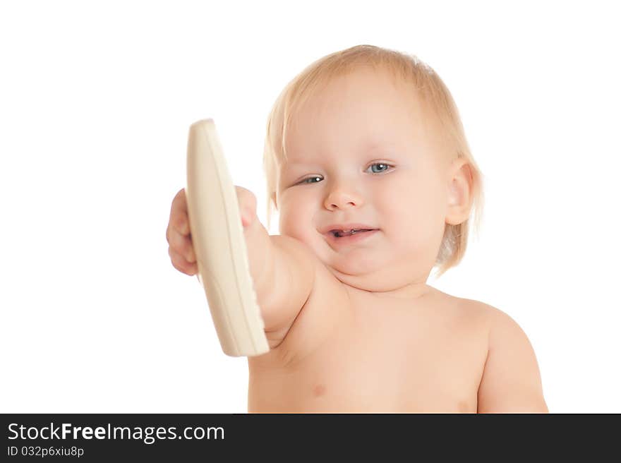 Young sitting baby with phone in hand