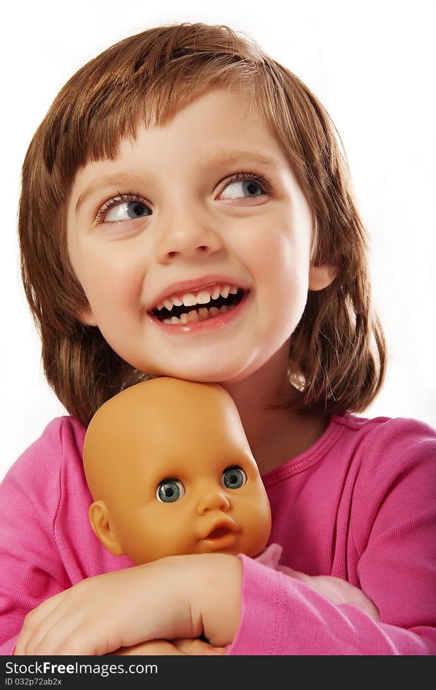 Happy little girl with doll isolated