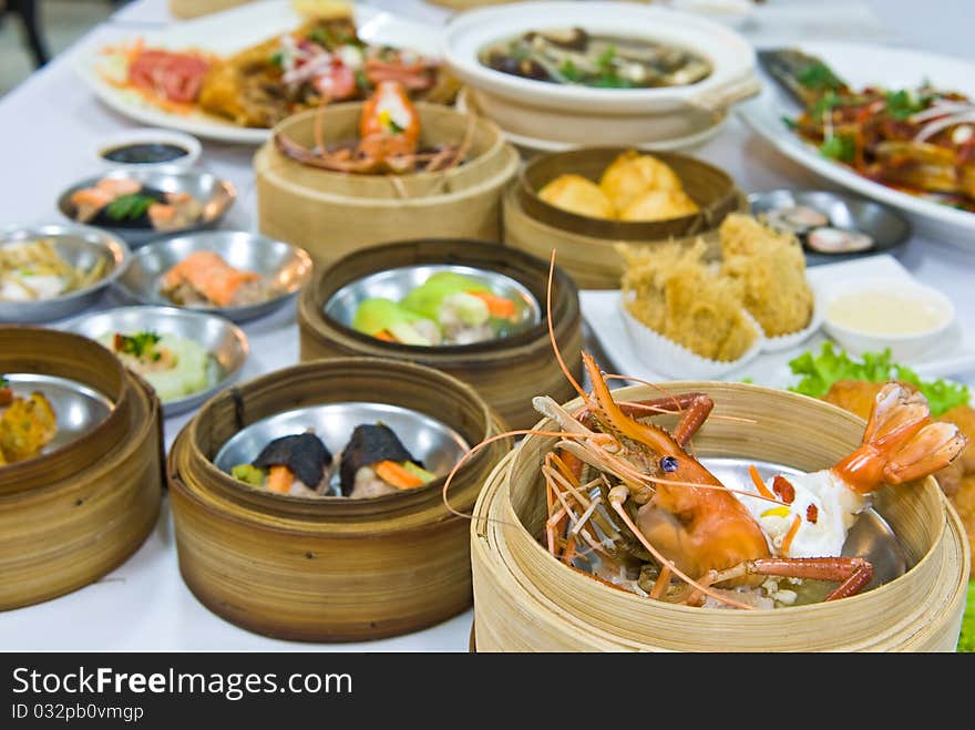 Chinese steamed dimsum in bamboo containers traditional cuisine. Chinese steamed dimsum in bamboo containers traditional cuisine