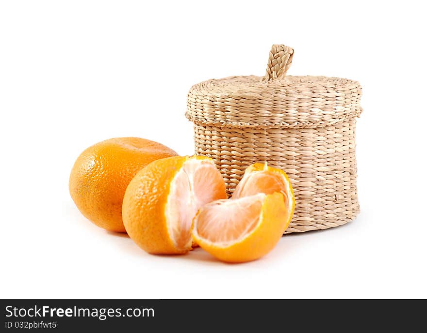 Wicker boxe and mandarin. Isolated on white background.