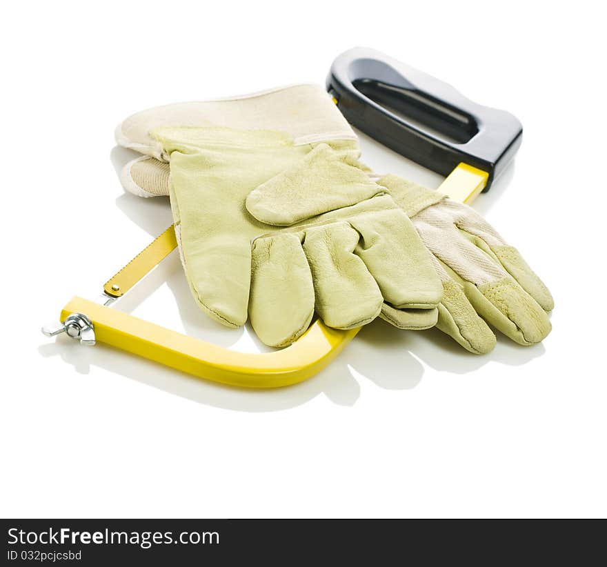 Gloves on hacksaw isolated on white background