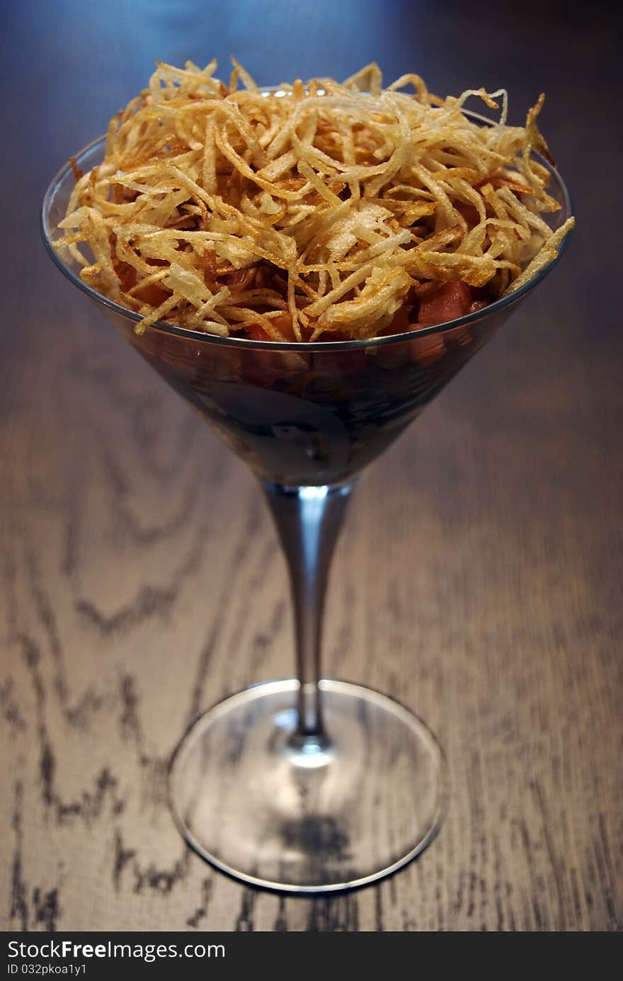 Salad with crunchy potato in glass. Salad with crunchy potato in glass