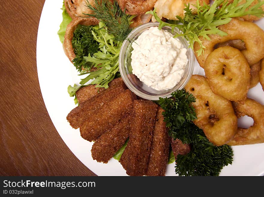 Appetizer made of fried onion, potato and bread. Appetizer made of fried onion, potato and bread