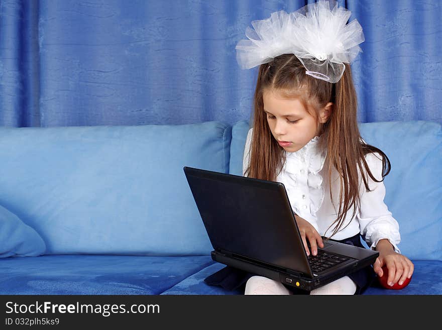 Girl With Laptop And Red Apple