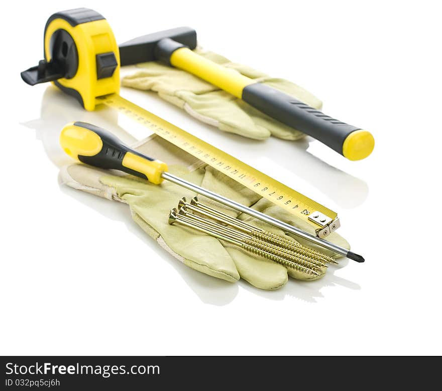 Gloves with working tools isolated on white background