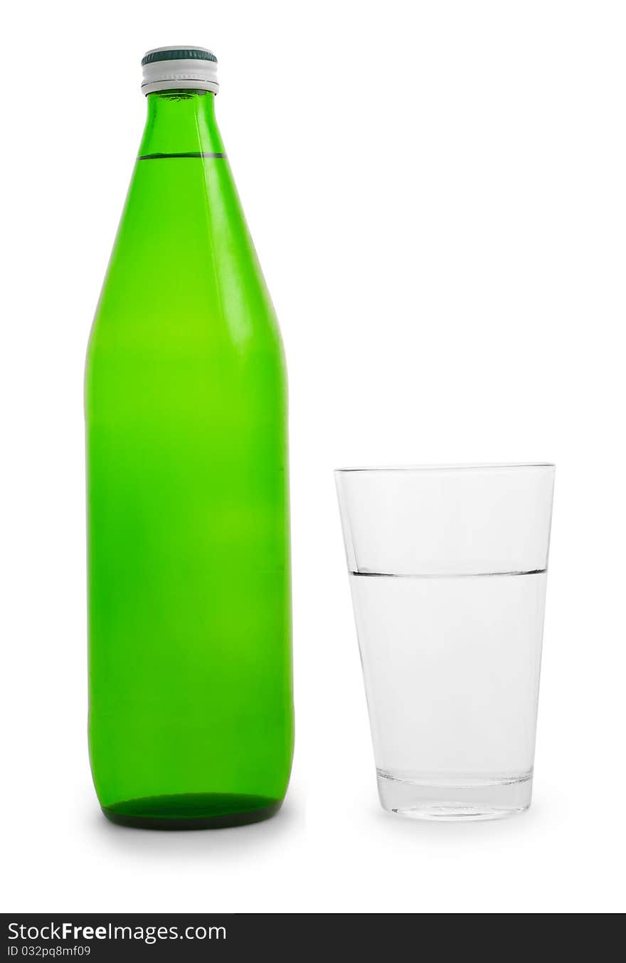 Green bottle and glass of water isolated