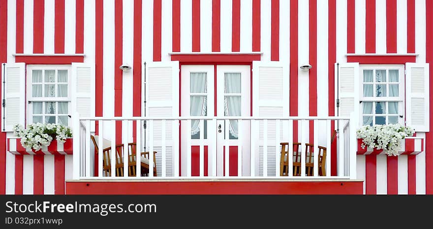 Red striped traditional portuguese wood house. Red striped traditional portuguese wood house.