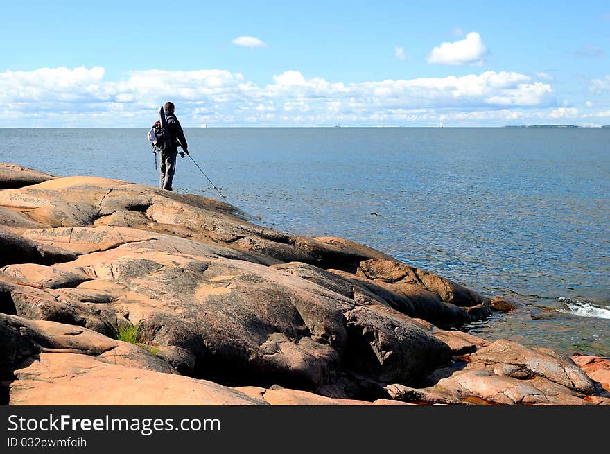 A fisherman angling on the sea