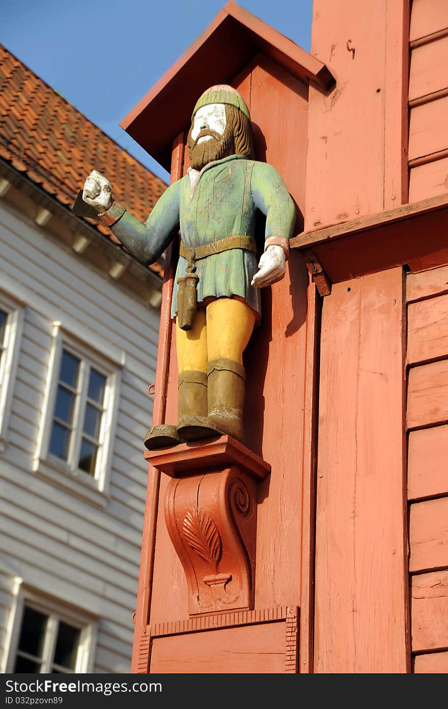 Figure on a facade of the ancient wooden house in Bergen, Norway