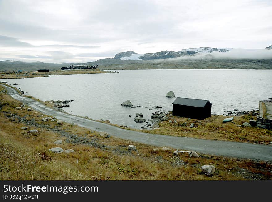 Cotage in Norway on the mountain lake beach