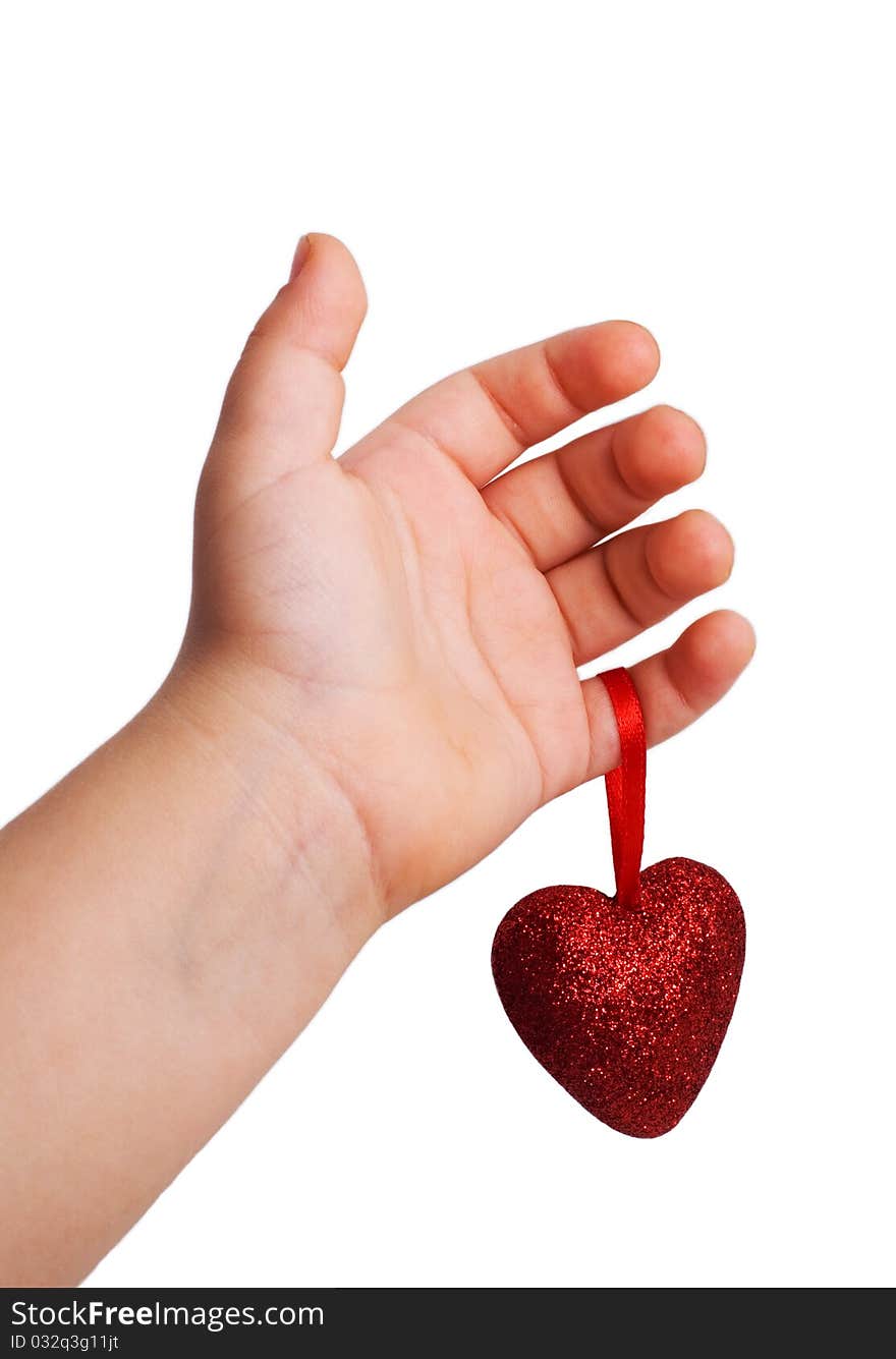 Red heart in the children's arm, white background