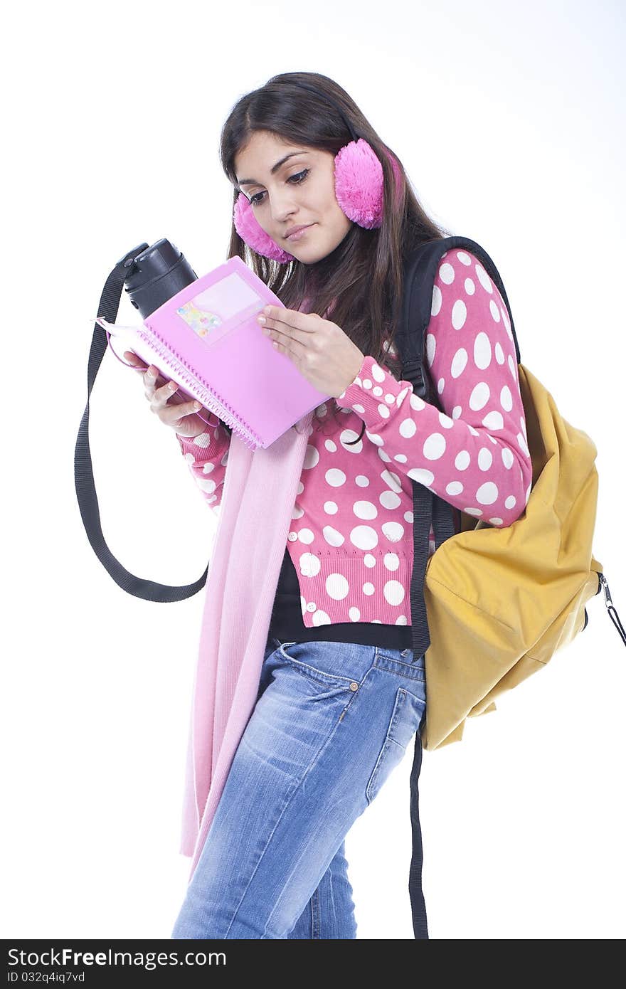 Young student girl reading a book