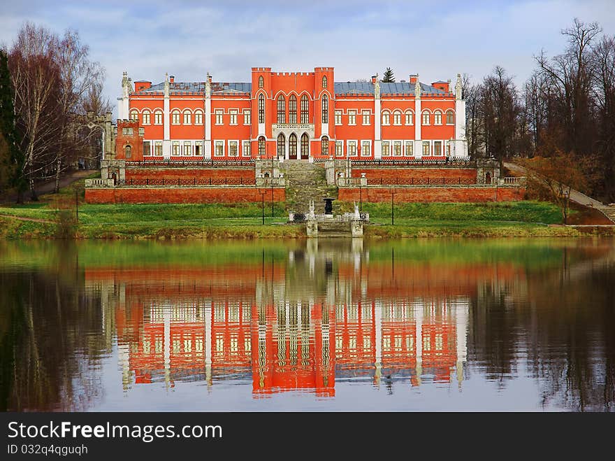 Kind on ancient manor with a pond. Kind on ancient manor with a pond