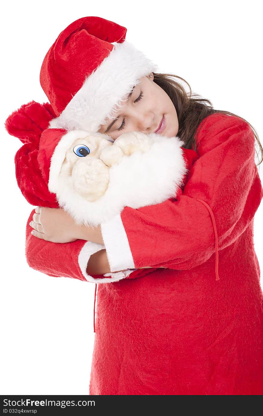 Young girl holding a christmas bag and dreaming