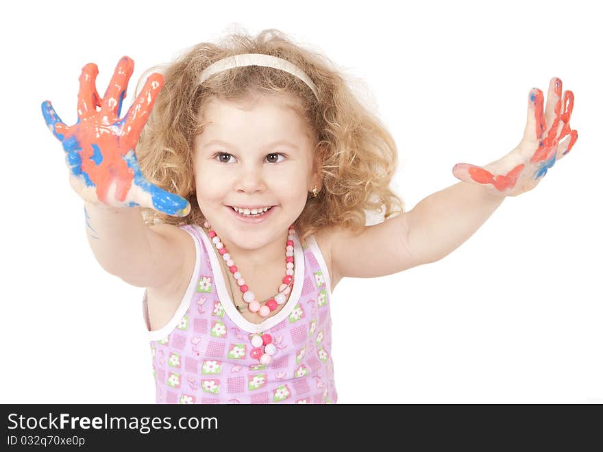 The little girl draws dark blue paints the hand. The little girl draws dark blue paints the hand