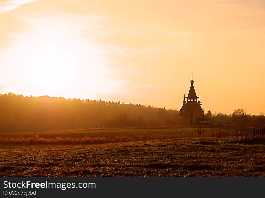 Small wooden church and sunset. Small wooden church and sunset