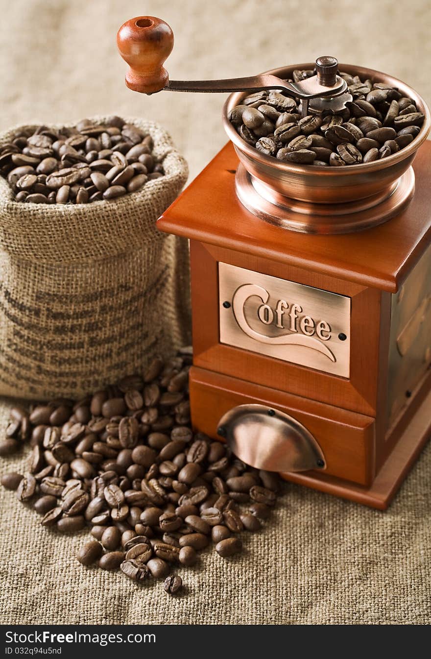 Coffee beans in bag and coffee mill