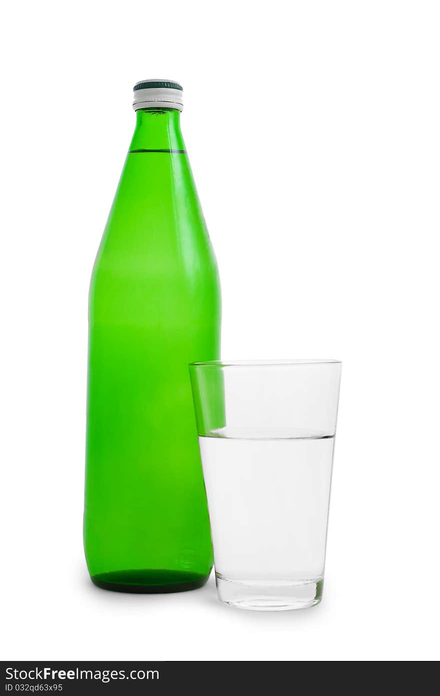 Green bottle and glass with water isolated on white background