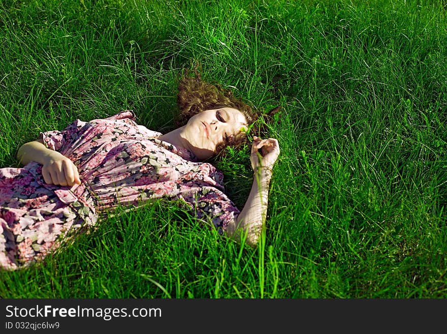 Beautiful Girl Lying Down Of Grass