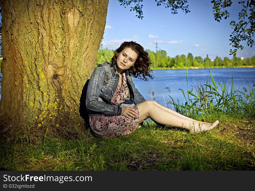 Beautiful brunett woman near the river. Beautiful brunett woman near the river