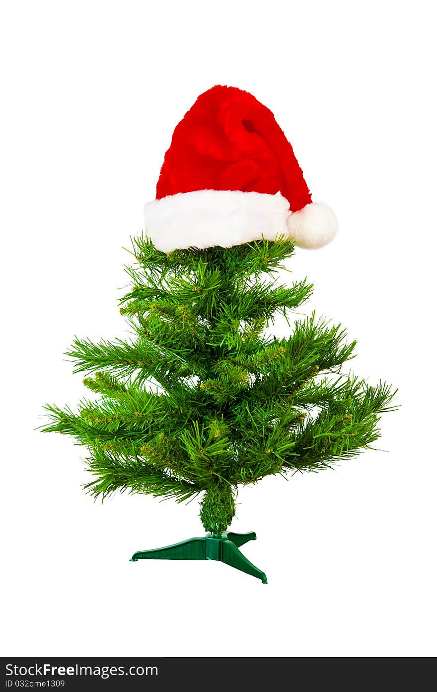 Xmas tree with red hat on white background. Xmas tree with red hat on white background