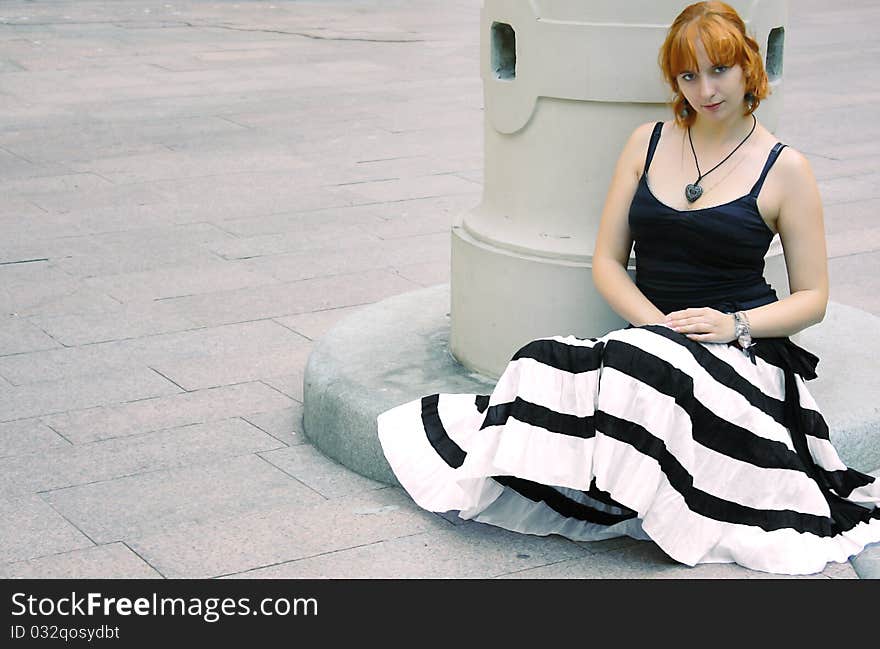 Young Red Woman In Flared Striped Black And White