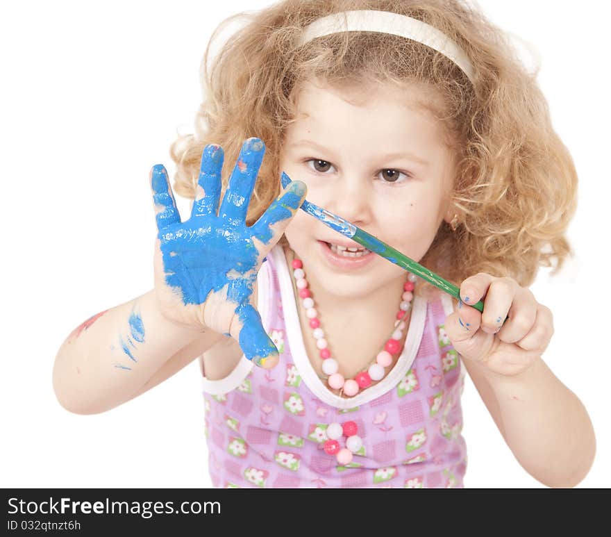 The little girl draws dark blue paints the hand. The little girl draws dark blue paints the hand