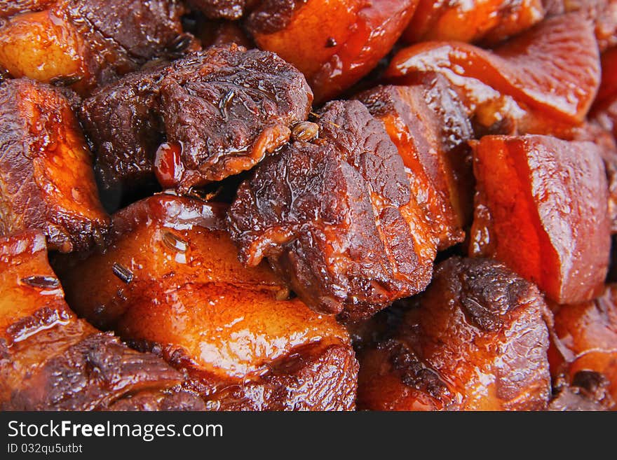 Chinese pork meat stew. Close up on white background