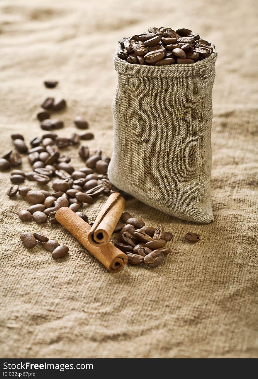 Coffee grains in bag with cinnamon