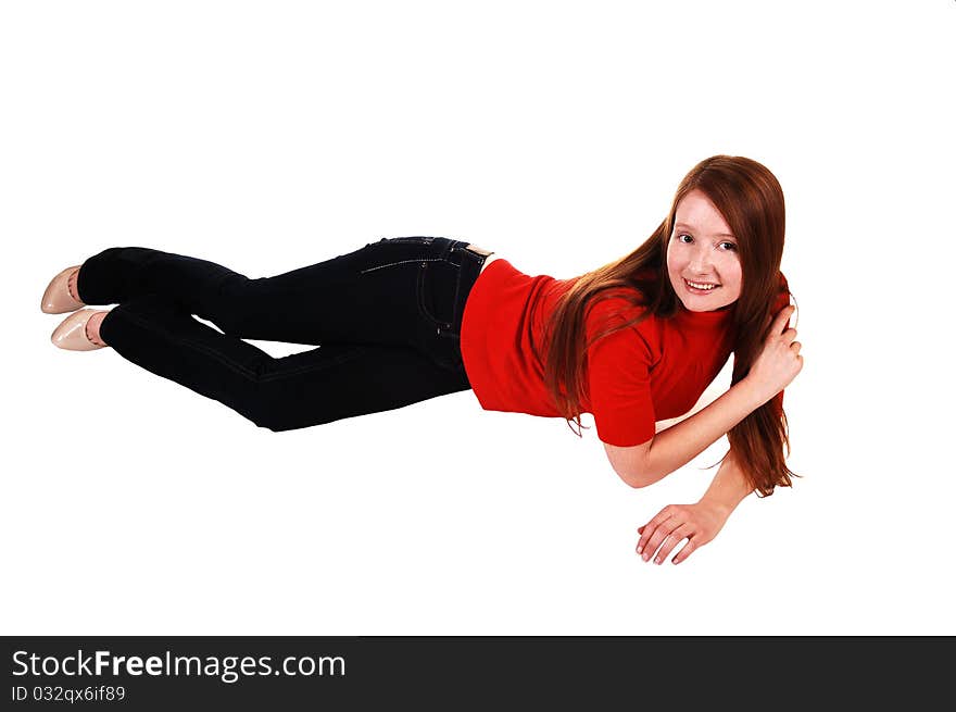 A pretty woman with long red hair in colorful tights, a black sweater and a fur hat and brown boots smiling for a portrait for white background. A pretty woman with long red hair in colorful tights, a black sweater and a fur hat and brown boots smiling for a portrait for white background.